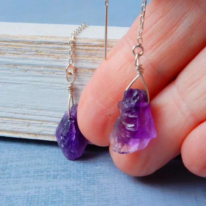 raw amethyst silver threader earrings on model hand