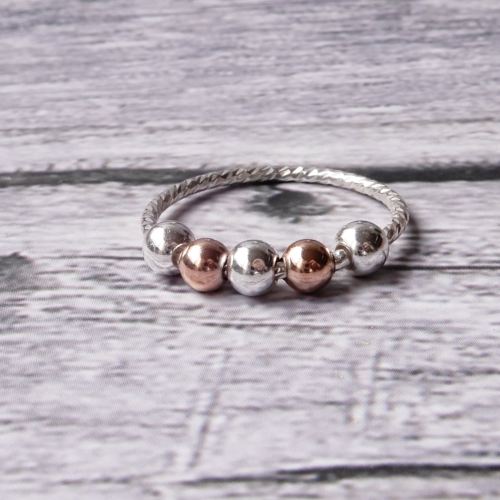 sensory fidget ring on gray wood background