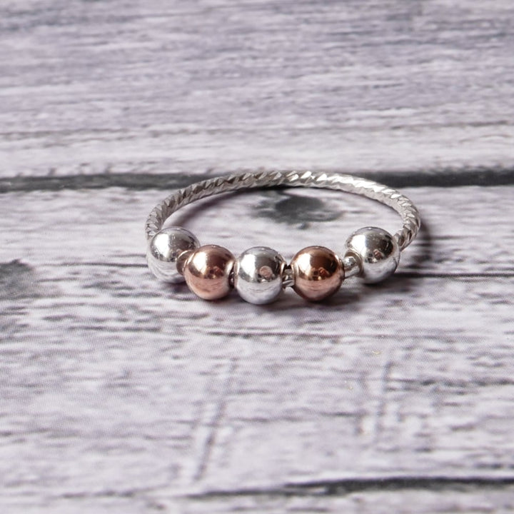 sensory fidget ring on gray wood background