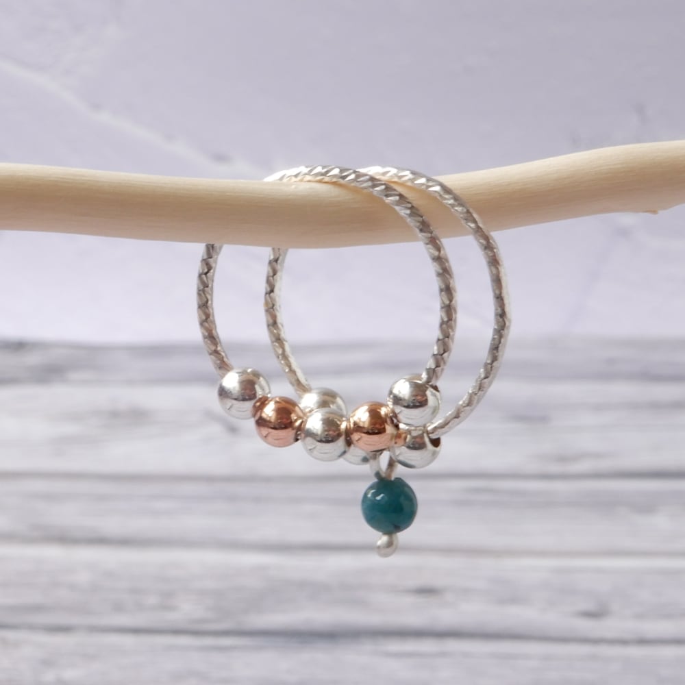 silver sensory fidget ring on wood stick