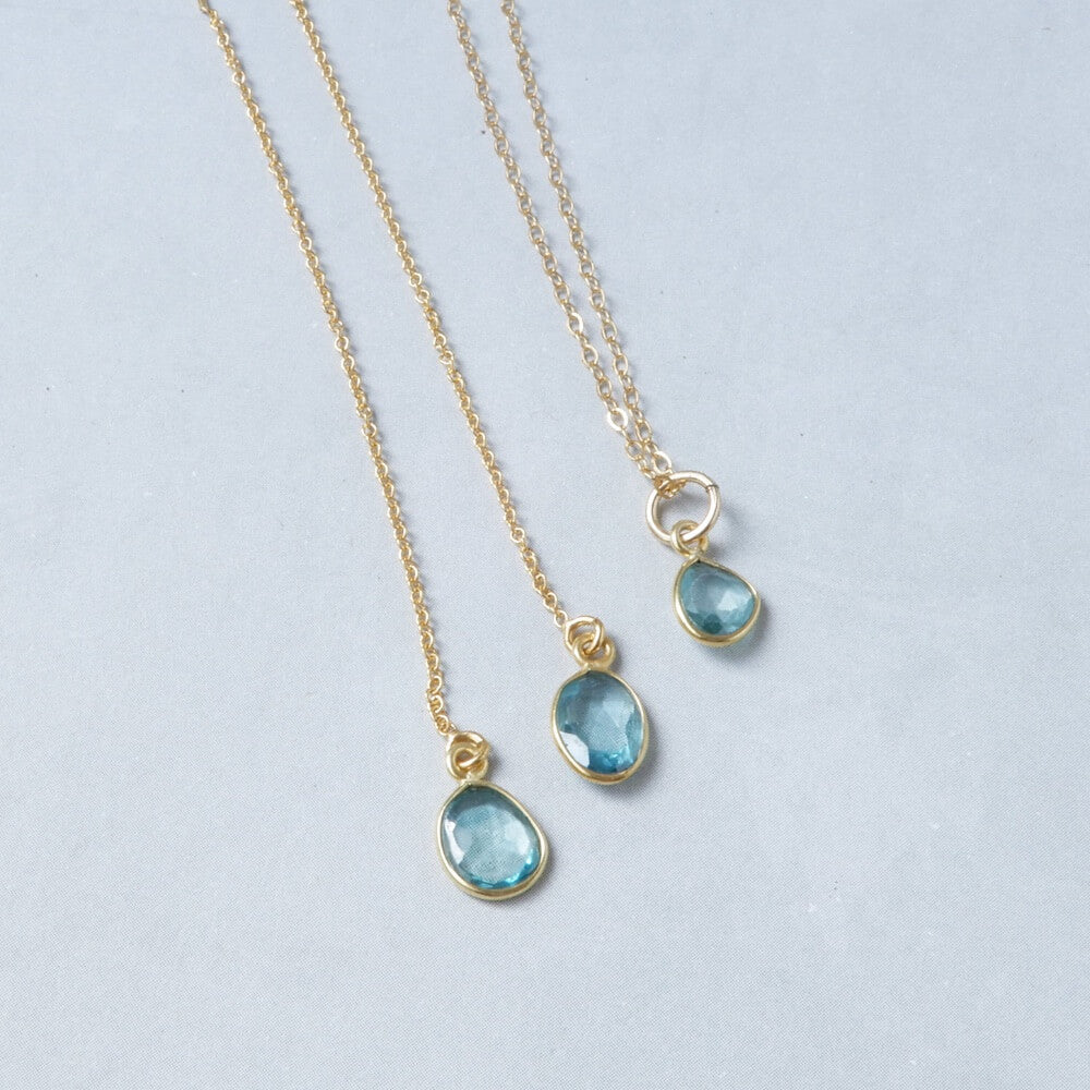 blue zircon gold jewelry set on white background