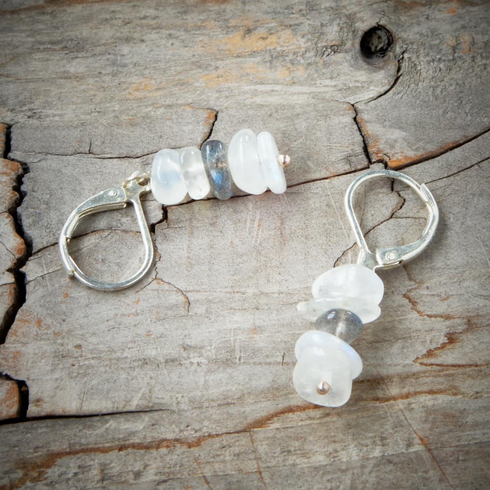 moonstone labradorite silver dangle earrings on wood