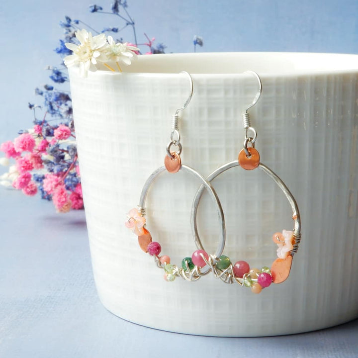 cherry blossom hoop earrings on cup