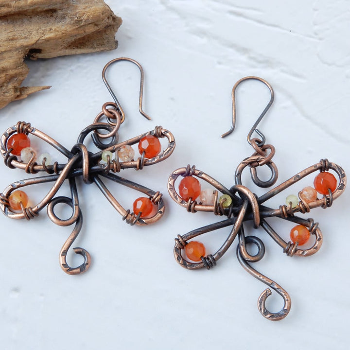hammered copper dragonfly dangle earrings with carnelian