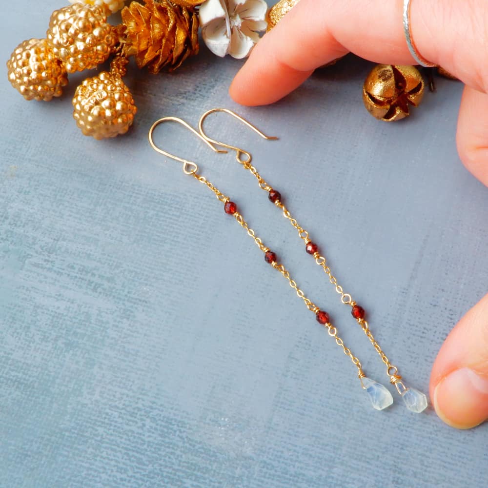delicate gold chain garnet moonstone dangle earrings