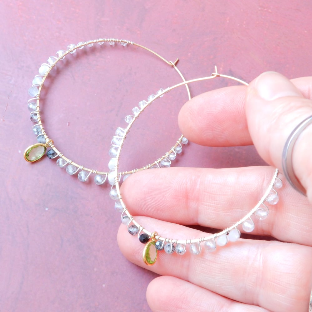 gold filled large gemstone hoops with peridot in model hand