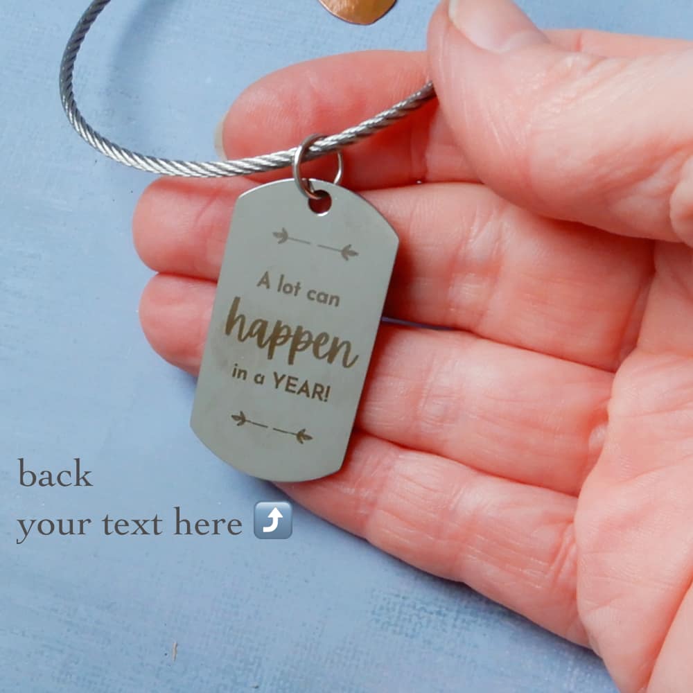 back side of one little word keeper tag