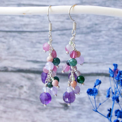 pink purple mix gemstone silver chandelier earrings on wood background