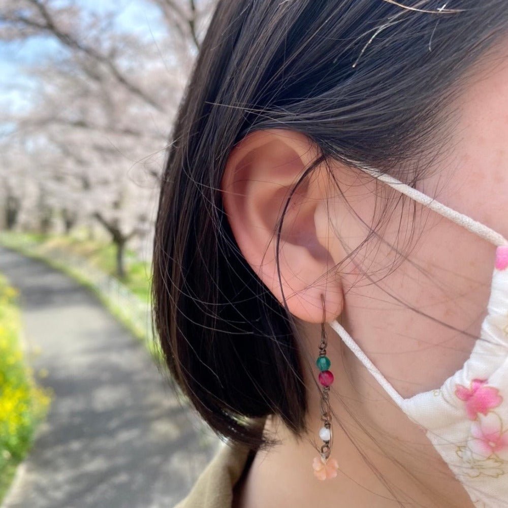 sakura dangle earrings on model